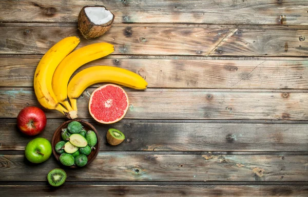 stock image Healthy food. Ripe organic fruits and vegetables. On a wooden background.