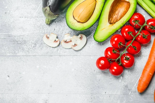 stock image Healthy food. Variety of organic fruits and vegetables. On a rustic background.