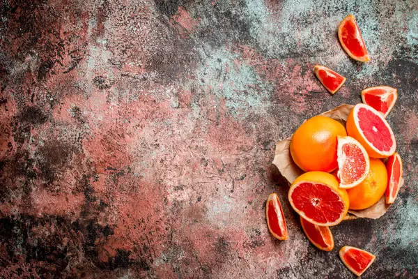 stock image Ripe grapefruit in the basket. On rustic background