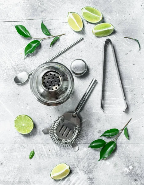 stock image Shaker and fresh juicy lime. On rustic background