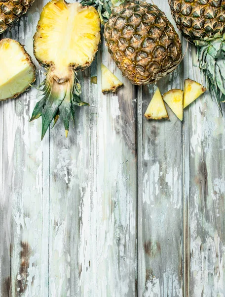 Cut Whole Pineapple Fragrant Foliage Wooden Background — Stock Photo, Image