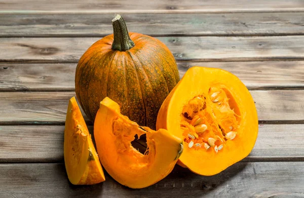 Whole Pieces Ripe Pumpkin Wooden Background — Stock Photo, Image