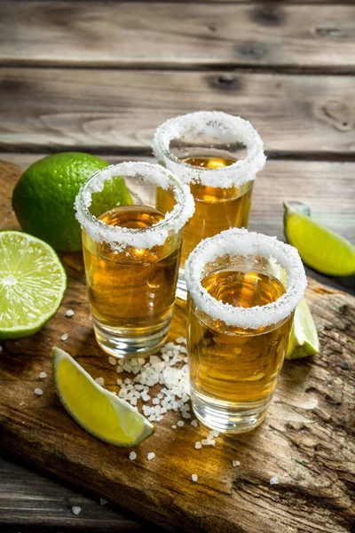 Tequila Shot Glass Cutting Board Slices Lime Wooden Background — Stock Photo, Image