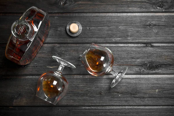 Cognac Glass Bottle Glasses Black Wooden Background — Stock Photo, Image