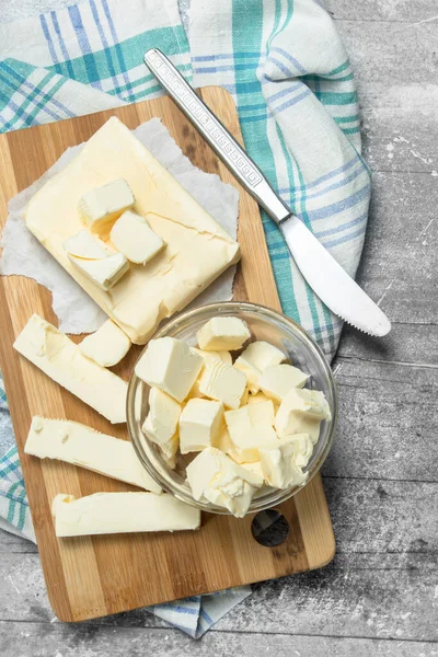 stock image Butter with a napkin. On a rustic background.