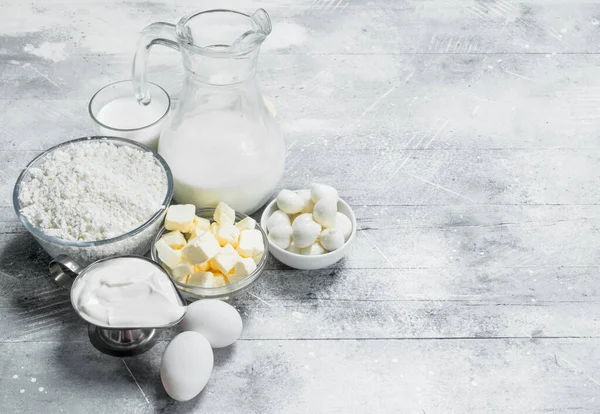 stock image Fresh dairy products . On a rustic background.