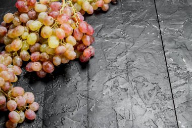 White grape. On black rustic background