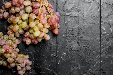 White grape. On black rustic background
