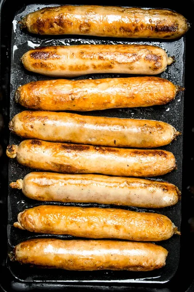 Fried Sausages Baking Sheet Wooden Background — Stock Photo, Image