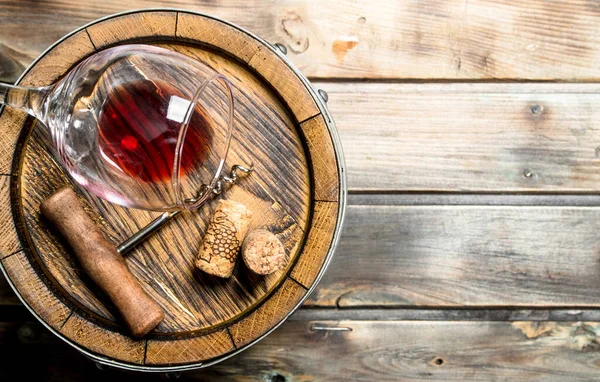 Stock image Wine background. Barrel of red wine. On a wooden background.