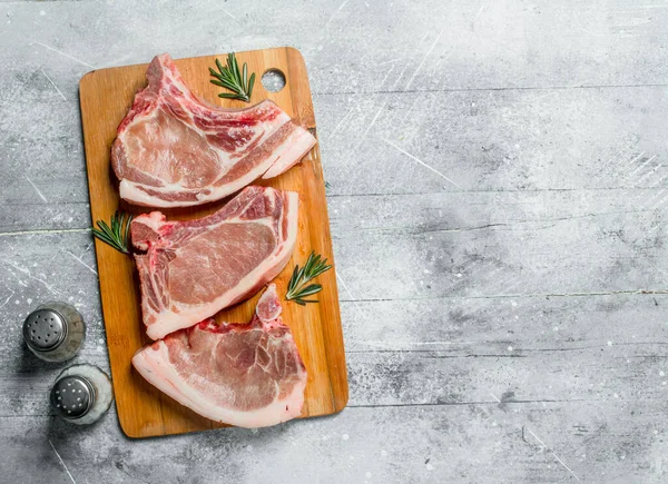 Raw Pork Steak Bone Rosemary Rustic Background — Stock Photo, Image