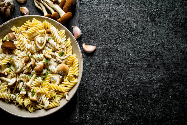 Fusilli Pasta Mushrooms Garlic Black Rustic Background — Stock Photo, Image