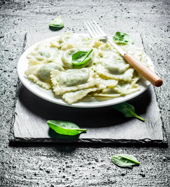 Stock image Ravioli with veal. On black rustic background