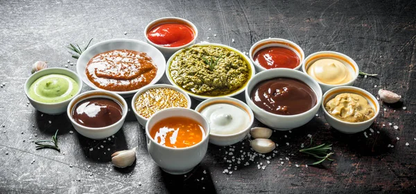 stock image Mix from different kinds of sauces. On dark rustic background