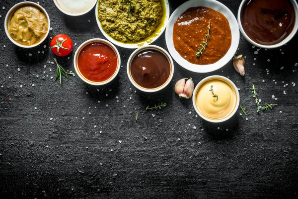 Bowls Delicious Sauces Black Rustic Background — Stock Photo, Image