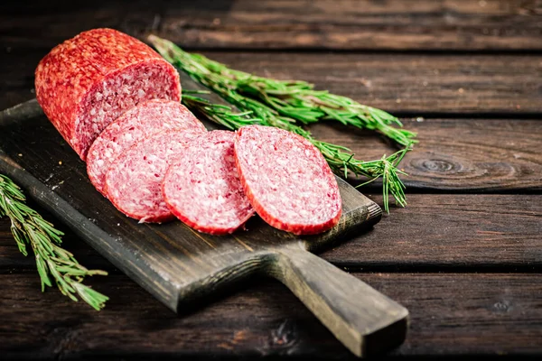 Pieces Salami Sausage Rosemary Cutting Board Wooden Background High Quality — Stock Photo, Image