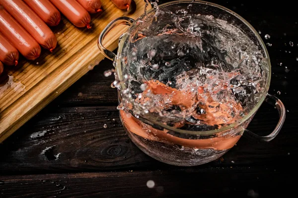 Sausages Boiled Fall Pot Splashes Water Dark Background High Quality — Stock Photo, Image