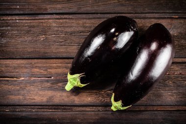 Fresh homemade eggplant on the table. On a wooden background. High quality photo