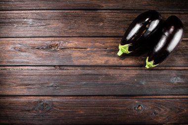 Fresh homemade eggplant on the table. On a wooden background. High quality photo