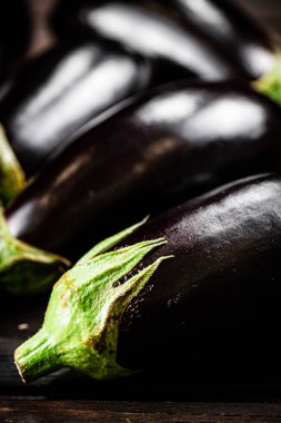 Fresh homemade eggplant on the table. On a wooden background. High quality photo