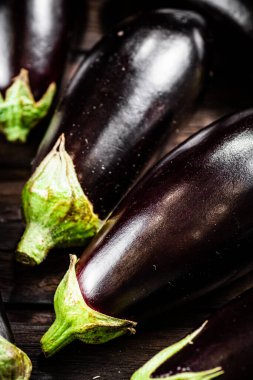 Fresh homemade eggplant on the table. On a wooden background. High quality photo