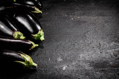 Fresh homemade eggplant on the table. On a black background. High quality photo