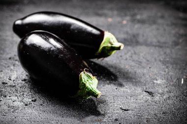 Fresh homemade eggplant on the table. On a black background. High quality photo