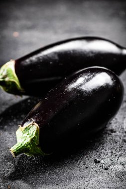 Fresh homemade eggplant on the table. On a black background. High quality photo