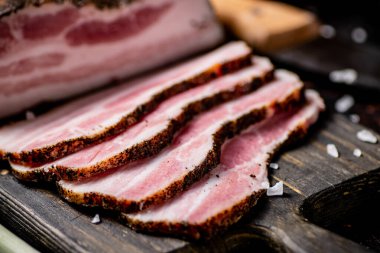Pork lard cut on a cutting board. Against a dark background. High quality photo