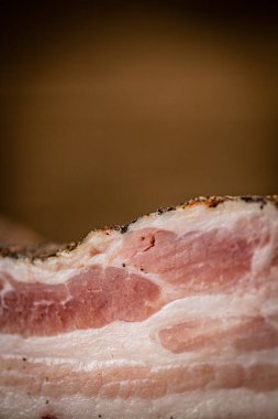 A piece of delicious pork fat lard. On a wooden background. High quality photo