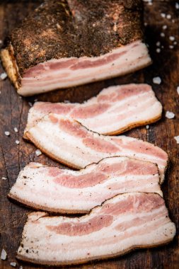 Pieces of lard on a cutting board. Macro background. High quality photo