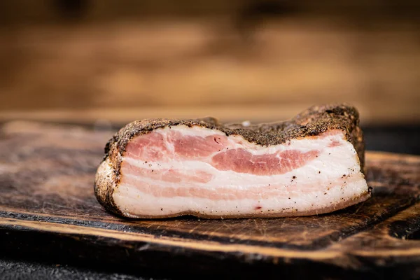 Stock image A piece of delicious pork fat lard. On a wooden background. High quality photo