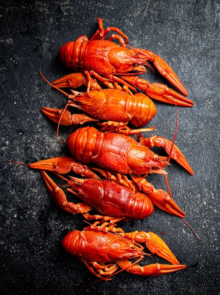 stock image Delicious boiled crayfish on the table. On a black background. High quality photo