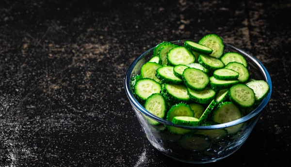 Full Glass Bowl Chopped Fresh Cucumbers Black Background High Quality — 图库照片