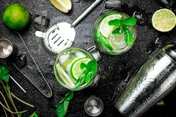 stock image Mojito with mint and ice. On a black damp background. High quality photo