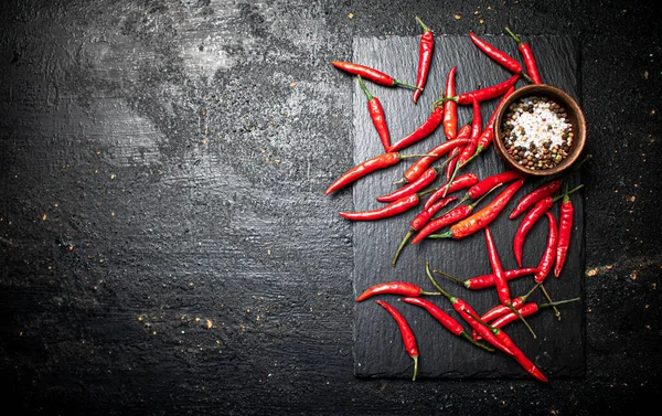 Chili Pepper Pods Stone Board Black Background High Quality Photo — Fotografia de Stock