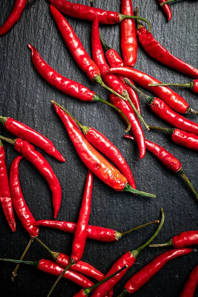 Chili Pepper Pods Stone Board Black Background High Quality Photo — стоковое фото