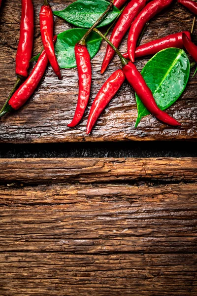 Chili Peppers Table Wooden Background High Quality Photo — стоковое фото