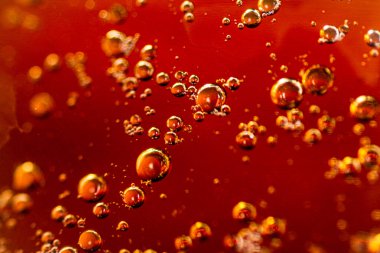 Apple juice with air bubbles. Macro background. High quality photo
