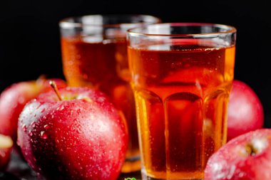 Fresh homemade apple juice. On a black background. High quality photo