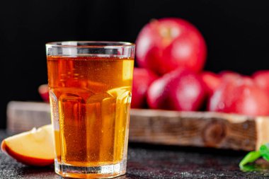 Fresh homemade apple juice. On a black background. High quality photo