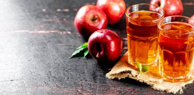 Fresh apple juice. Against a dark background. High quality photo
