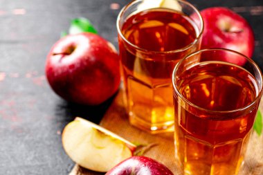 Fresh apple juice. Against a dark background. High quality photo