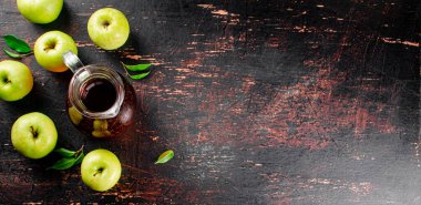 Fresh apple juice. Against a dark background. High quality photo