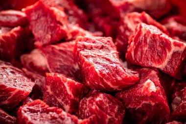 Pieces of raw beef. Macro background. The texture of the meat. High quality photo