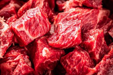 Pieces of raw beef. Macro background. The texture of the meat. High quality photo