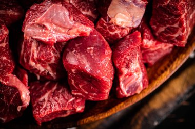 Raw beef sliced on a dark background. High quality photo