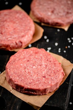 Fresh raw burger on the table. Macro background. High quality photo