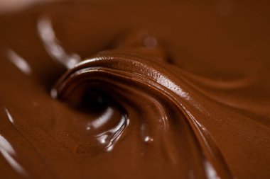 Hazelnut butter curl. Macro background. The texture of hazelnut butter . High quality photo