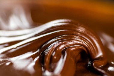 Hazelnut butter curl. Macro background. The texture of hazelnut butter . High quality photo